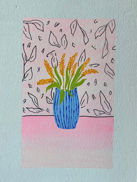 Orange foxgloves in blue vase