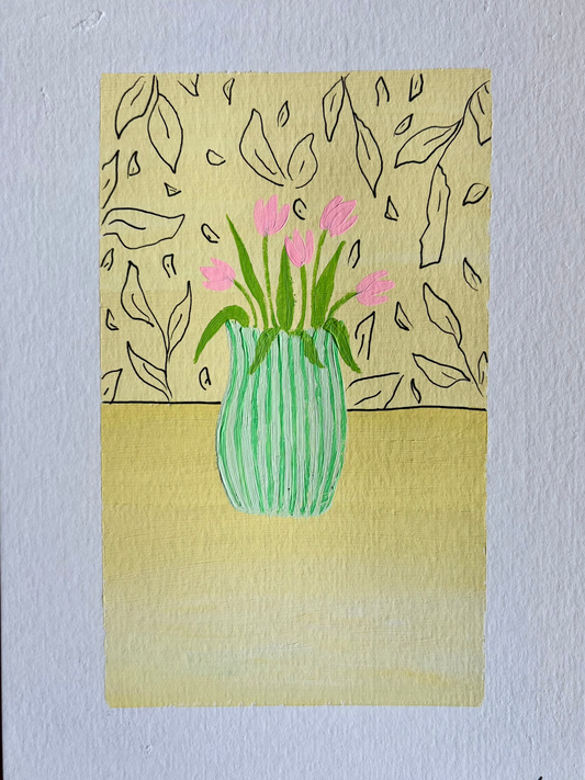 Pink tulips in green vase